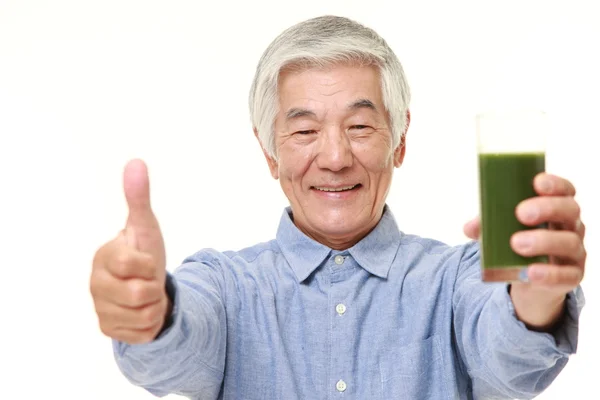 Senior Japanese man with green vegetable juice — Stock Photo, Image