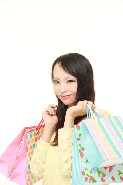 Japoński kobieta z torby na zakupy — Zdjęcie stockowe