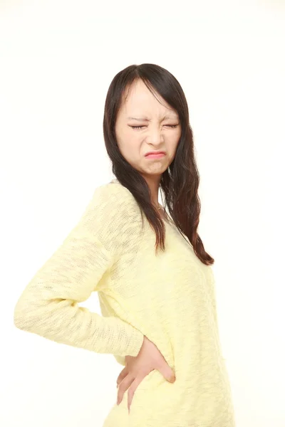 Japanese woman suffers from lumbago — Stock Photo, Image