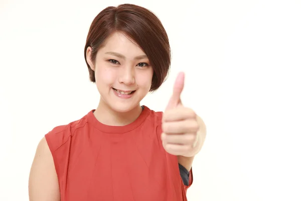 Jonge Japanse vrouw met Duimschroef opwaarts gebaar — Stockfoto
