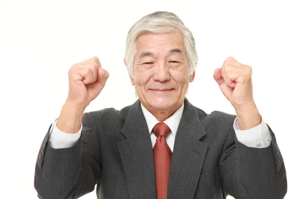 Starší japonský podnikatel v póze vítězství — Stock fotografie