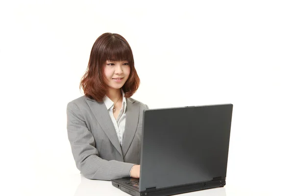 Portrait of  young Japanese office worker smiles — Stock Photo, Image