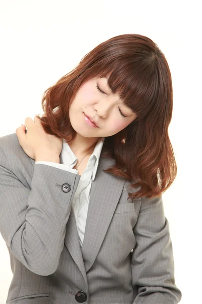 Donna d'affari giapponese soffre di mal di collo — Foto Stock