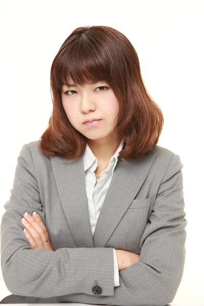 Jeune femme d'affaires japonaise de mauvaise humeur — Photo