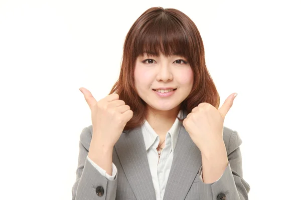 年轻的日本女商人与手势竖起大拇指 — 图库照片