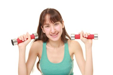 dumbbll egzersiz yaparak kadın