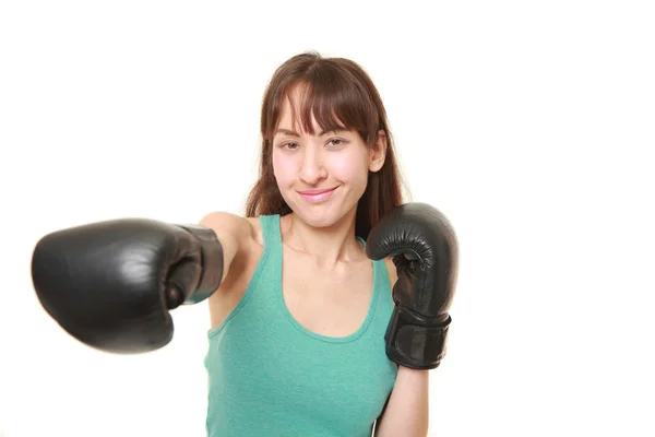Female boxer throws a right straight — Stock Photo, Image
