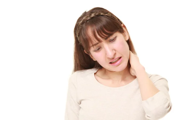 首の痛みに苦しんでいる若い女性 — ストック写真