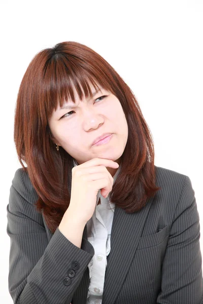 Japoński kobieta interesu martwi się o coś — Zdjęcie stockowe