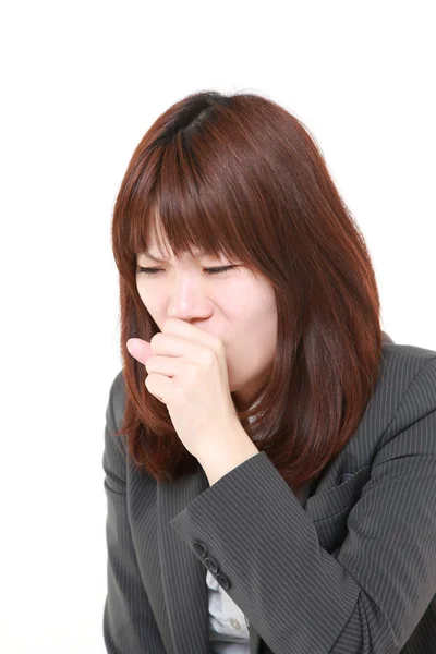 Young Japanese businesswoman coughing — Stock Photo, Image