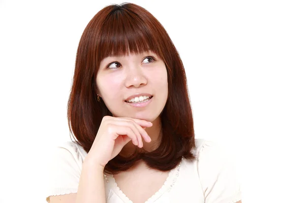 Joven japonesa mujer piensa en algo —  Fotos de Stock