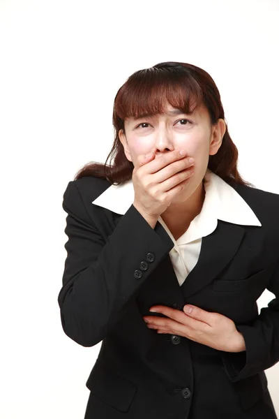 Asiática mujer de negocios se siente como vomitar —  Fotos de Stock