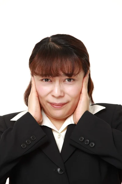 Asian businesswoman suffers from noise — Stock Photo, Image