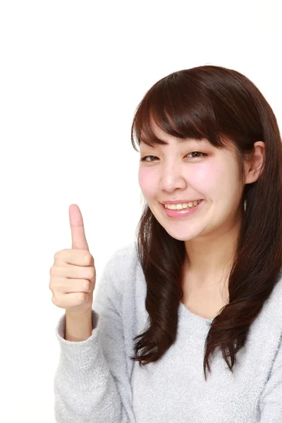 Joven japonesa mujer con los pulgares hacia arriba gesto — Foto de Stock