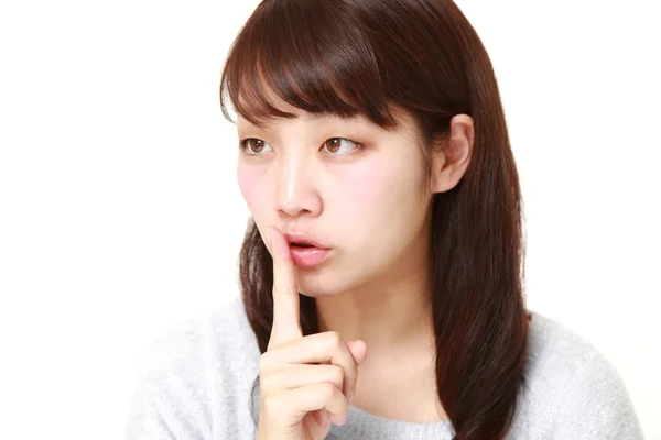 Young Japanese woman whith silence gestures — Stock Photo, Image