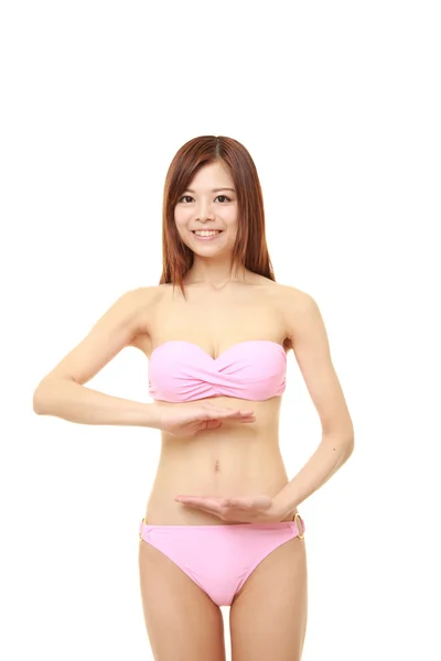 Woman with hands over belly — Stock Photo, Image