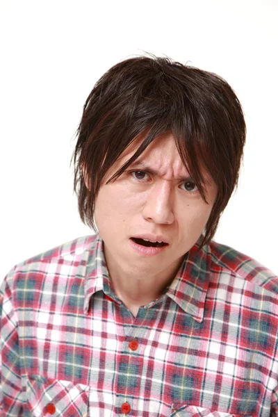Jonge Japanse man in een slecht humeur — Stockfoto