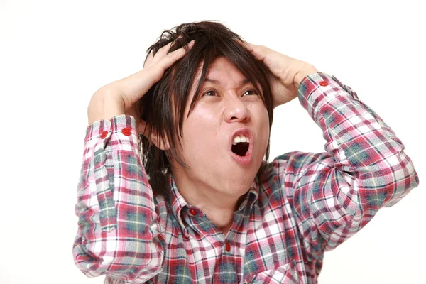 Jovem japonês homem chocado — Fotografia de Stock