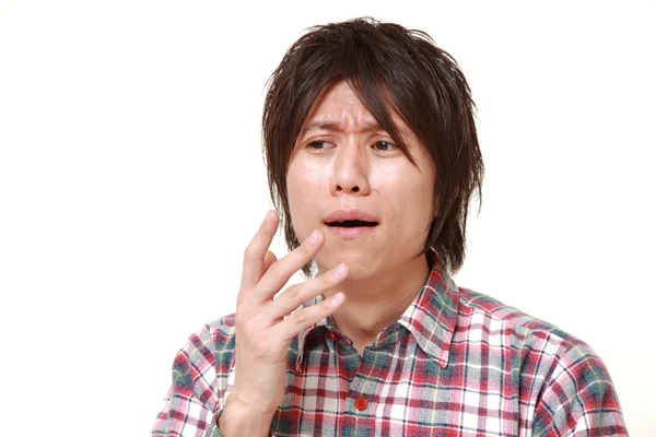 Young Japanese man shocked — Stock Photo, Image