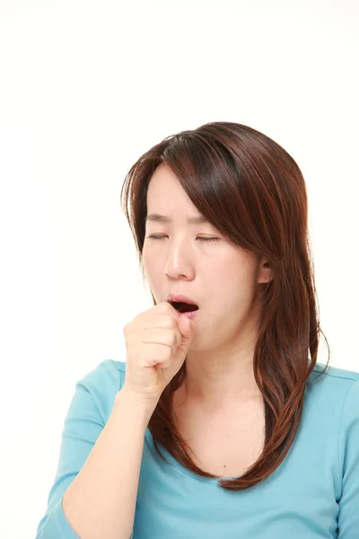Middle aged Japanese woman coughing — Stock Photo, Image