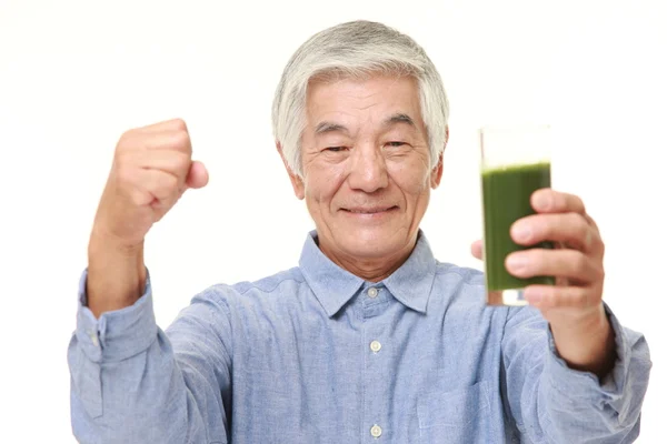 Senior Japanese man with green vegetable juice — Stock Photo, Image