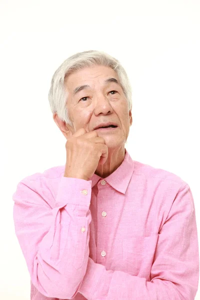 Senior japansk man tycker om något — Stockfoto