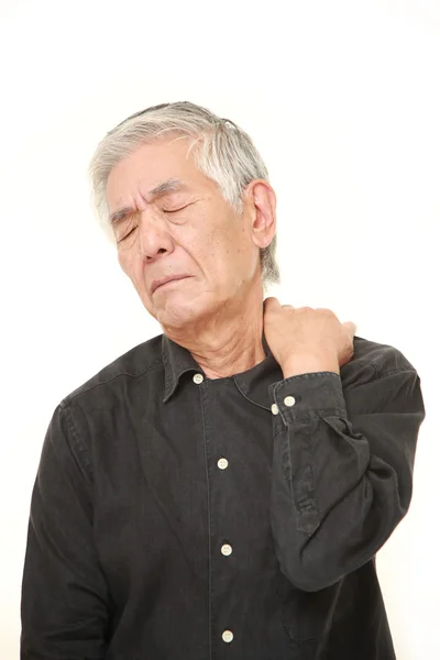 Senior Japanese man suffers from neck ache — Stock Photo, Image