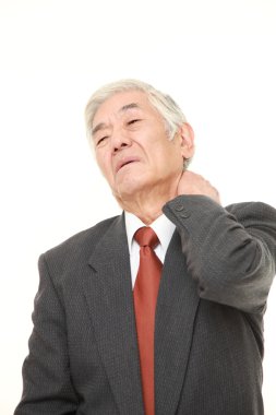 üst düzey Japon işadamı boyun ağrısı muzdarip