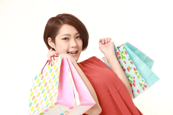 Japanese woman with shopping bags — Stock Photo, Image