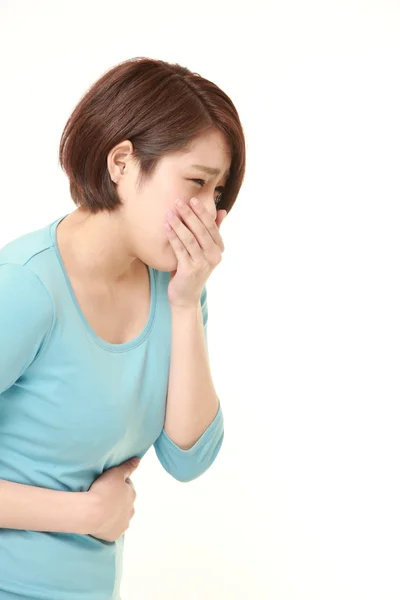 Jovem japonês mulher sente como vômito — Fotografia de Stock