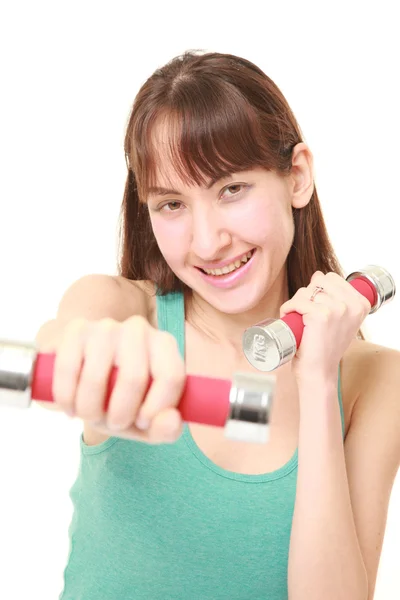 Woman doing dumbbll exercise — Stock Photo, Image