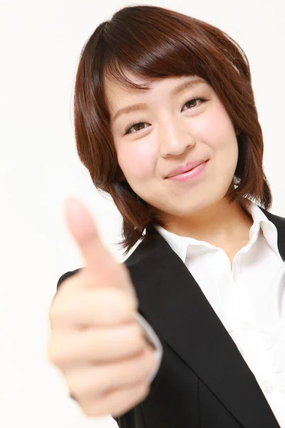 Japanische Geschäftsfrau mit Daumen-hoch-Geste — Stockfoto