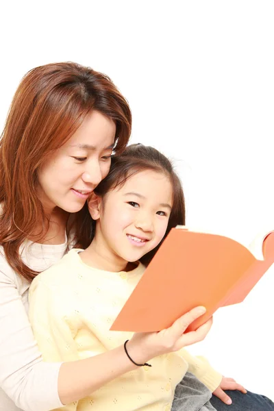 Japanese family of four on laptop computer — Stock Photo, Image