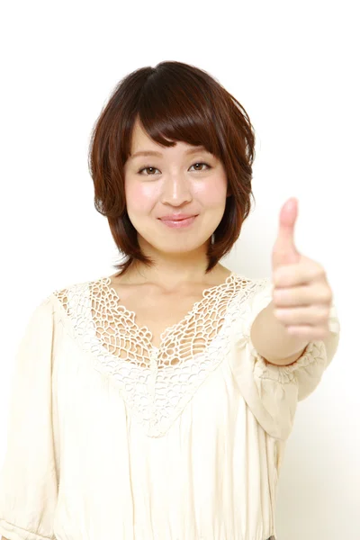 Woman with thumbs up gesture — Stock Photo, Image