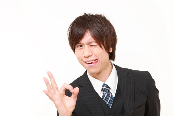 Fiatal japán üzletember tökéletes jel mutatja — Stock Fotó