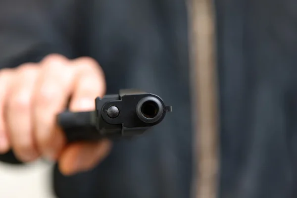 Man with a handgun — Stock Photo, Image