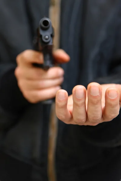 Robber with a handgun — Stock Photo, Image