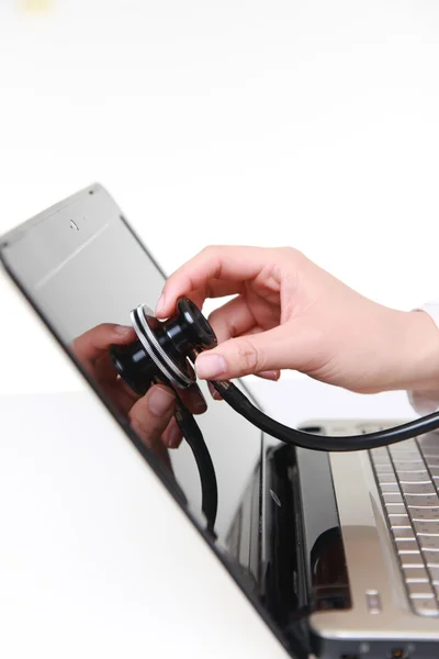 Medical doctor stethoscope examine a computer — Stock Photo, Image