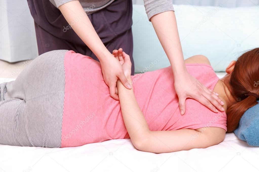 Japanese woman getting chiropractic