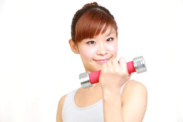 Woman doing dumbbell exercise — Stock Photo, Image