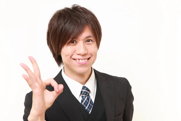 Young Japanese Business man showing perfect sign — Stock Photo, Image