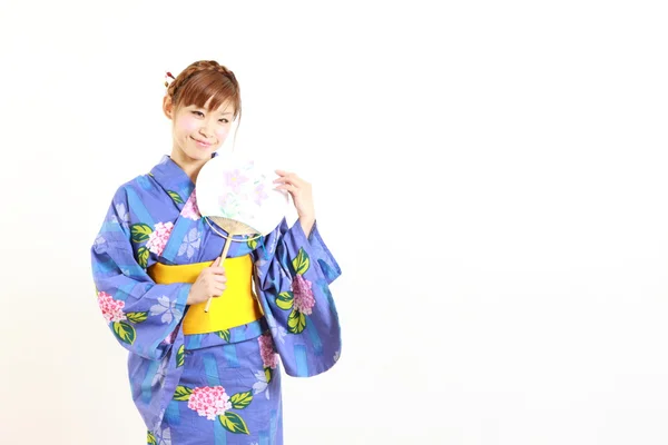 Young woman wearing Japanese kimono with paper Fan — Stock Photo, Image