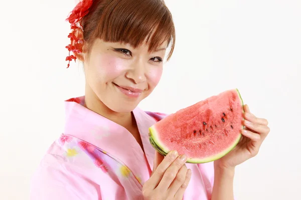 Young woman wearing Japanese kimono with watermelon — Stock Photo, Image