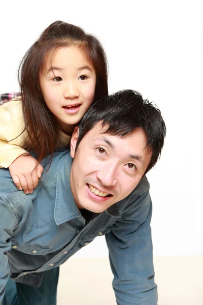 Japanese father and his daughter play horse-ride — Stock Photo, Image