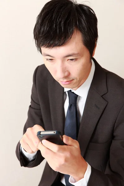 Businessman with smart phone — Stock Photo, Image