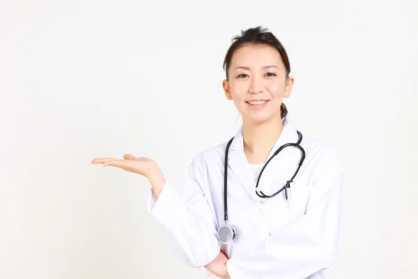 Young Japanese female doctor guides — Stock Photo, Image