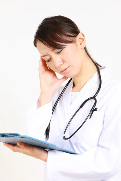 Young Japanese female doctor worries about something　 — Photo