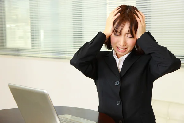 Panicking businesswoman — Stock Photo, Image