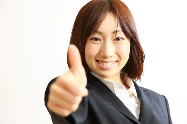Japonesa mujer de negocios con los pulgares hacia arriba gesto — Foto de Stock