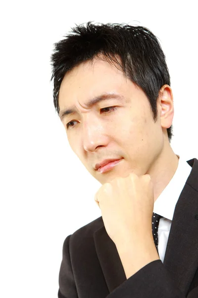 Japanese businessman thinks about something — Stock Photo, Image